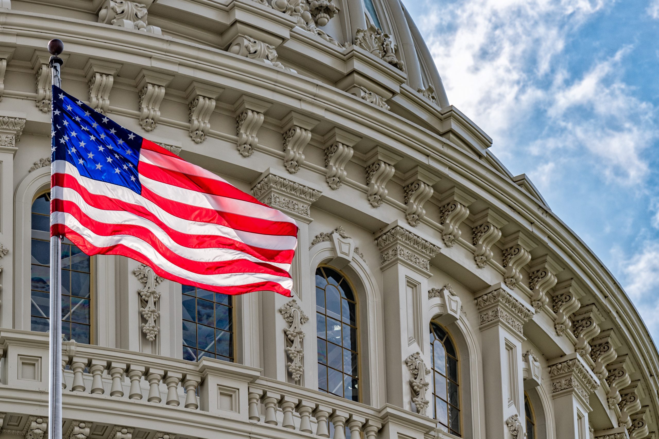 Washington,Dc,Capitol,Dome,Detail,With,Waving,American,Flag